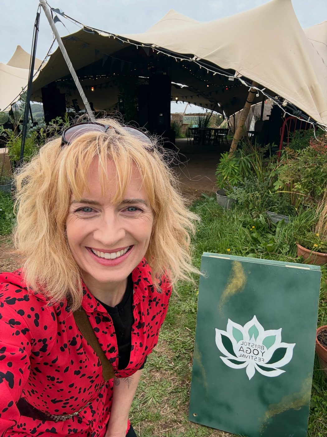 Sarah at the Bristol Yoga Festival sign